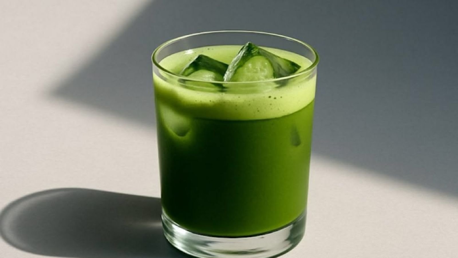 Iced matcha latte in a café glass Iced matcha latte with vivid green color hold in a café glass, the finished drink cafés should judge when choosing the best matcha powder for lattes